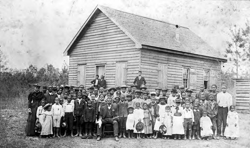 Students and teacher in front of Professor Jacobs school, early 1900's.