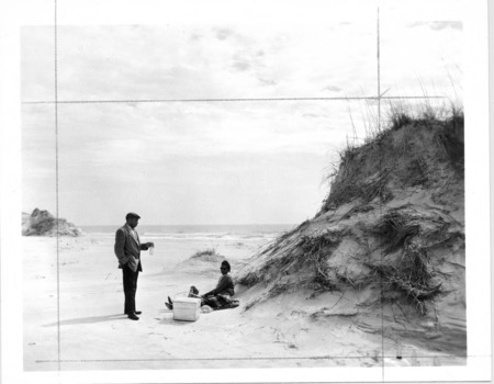 C. Payne Lucas and his wife, Freddie Hill Lucas, picnic on the beach, circa 1960.