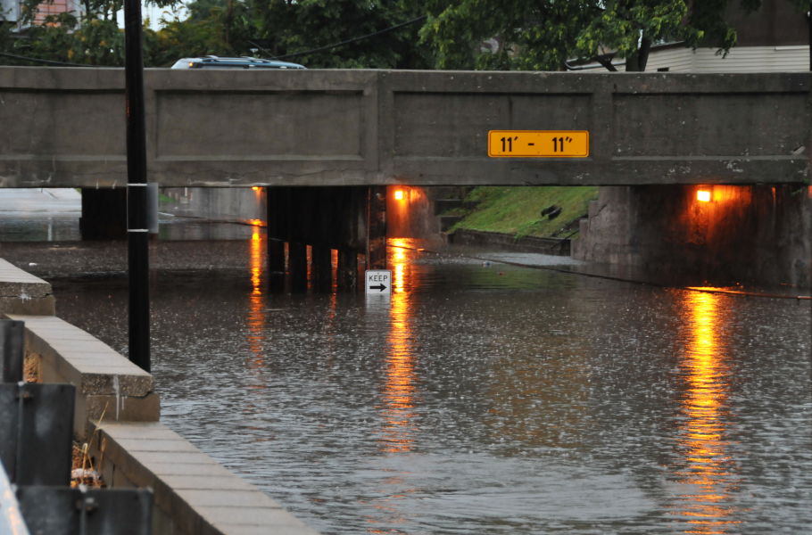 deep flood waters cover an underpass