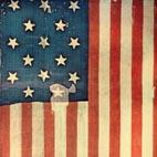 US flag behind protective glass