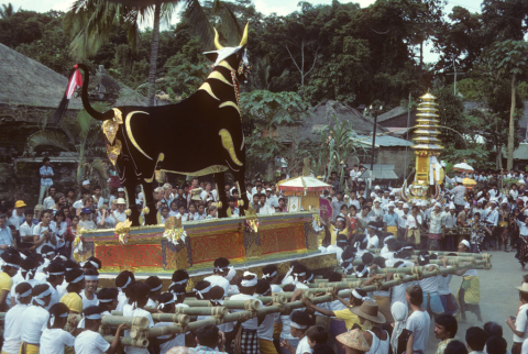 Cremation tower and bull figure in procession at Brahman's funeral