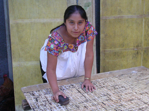 Girl making papel amaté