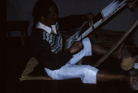 Weaving on a hand loom in Otavalo, Ecuador