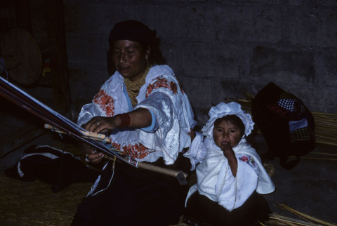Woman and child weaving near Otavalo, Ecuador
