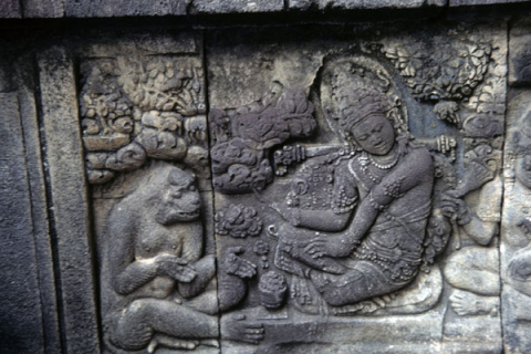 Stone stele at Prambanan Temple shows Sita sitting with monkey