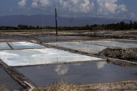 Wide view of salt-making fields along the coast south of Nha Trang