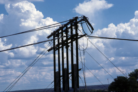 Power line hook-up over blue sky and clouds between Dalat and Ho Chi Minh City