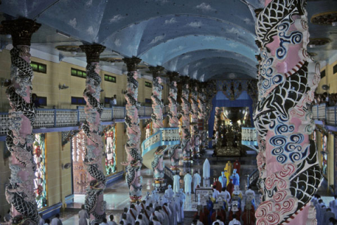 Colorful columns and hall of Cao Dai temple at Tay Ninh