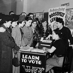 Women teaching other women how to vote